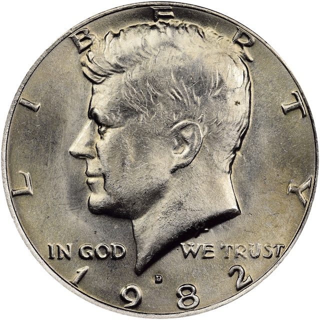 1982 Kennedy half dollar broadstrike error showing expanded diameter and missing reeded edge from collar failure during striking